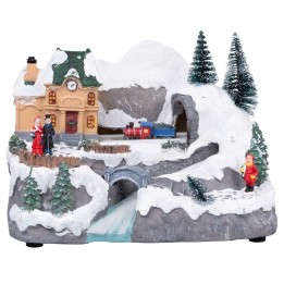 Christmas village with moving train equipped with lights and