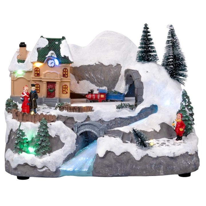 Christmas village with moving train equipped with lights and