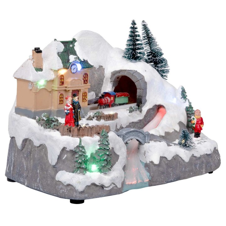 Christmas village with moving train equipped with lights and