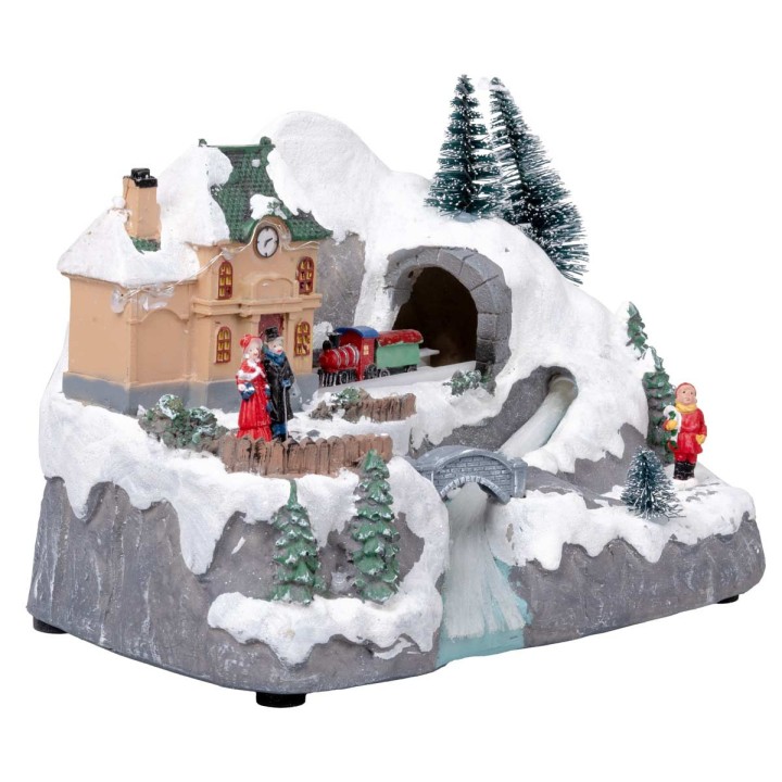 Christmas village with moving train equipped with lights and