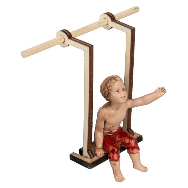 Bambino su altalena in legno serie 10 cm