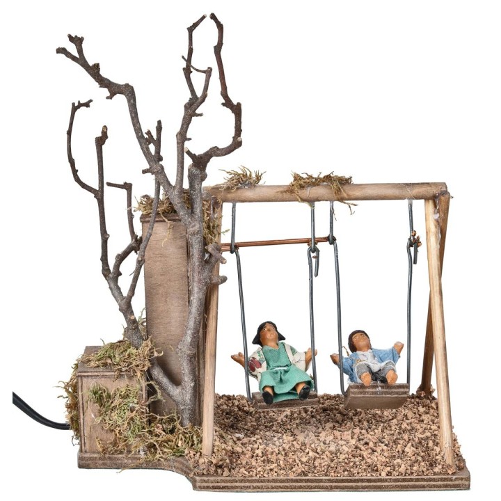 Pareja de niños en columpio serie 12 cm en movimiento