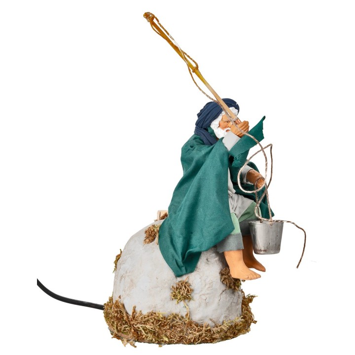 Fisherman on rock series 15 cm in motion