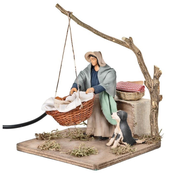 Mother with child in basket in motion 12 cm