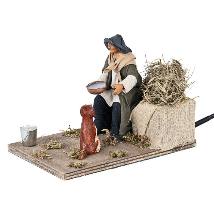 Hombre que da de beber al perro en movimiento 12 cm
