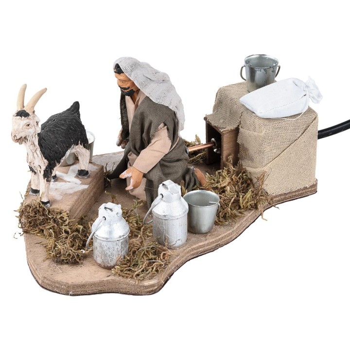 Man milking goat in motion 12 cm