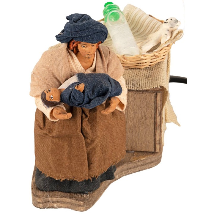 Mother breastfeeding child in arms in motion 10 cm