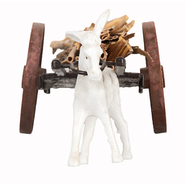 Straw wagon with donkey being towed
