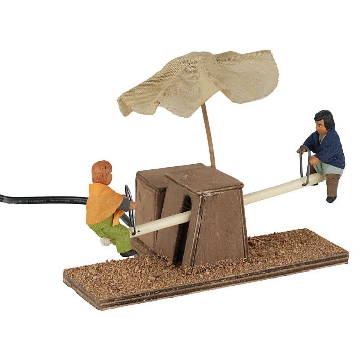 Children on the swing in motion 12 cm