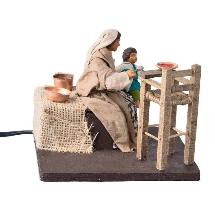 Mother feeding the child series 12 cm in motion