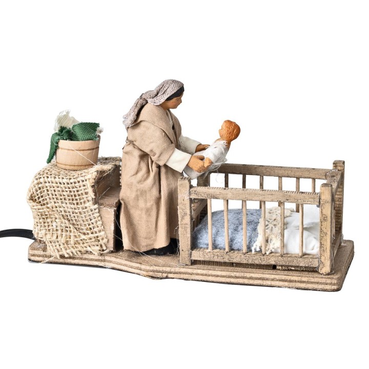 Mother taking child from cradle 10 cm in motion