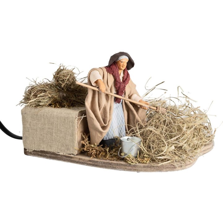 Peasant woman spreading hay 10 cm in motion