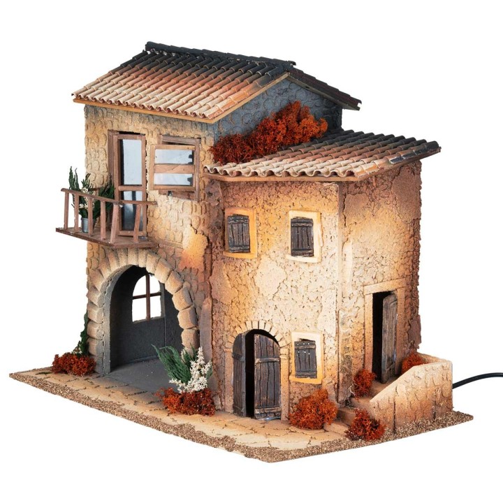 Borgo illuminato con donna in movimento cm 50x30x41.5 h
