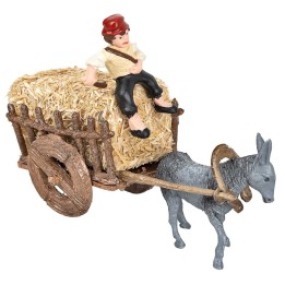 Man on donkey carrying cart loaded with hay