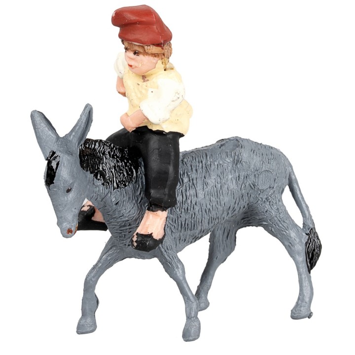 Man with whip riding a donkey