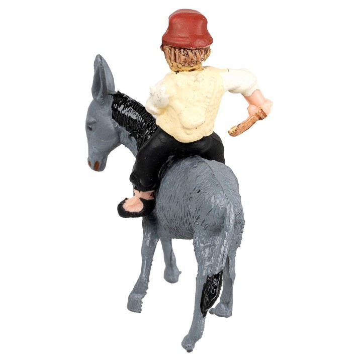 Man with whip riding a donkey