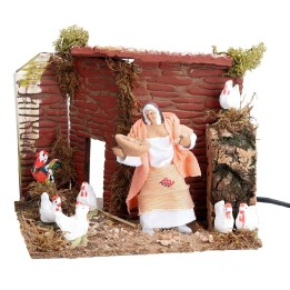 Farmer with hens 10 cm in motion 17x14x14 cm h