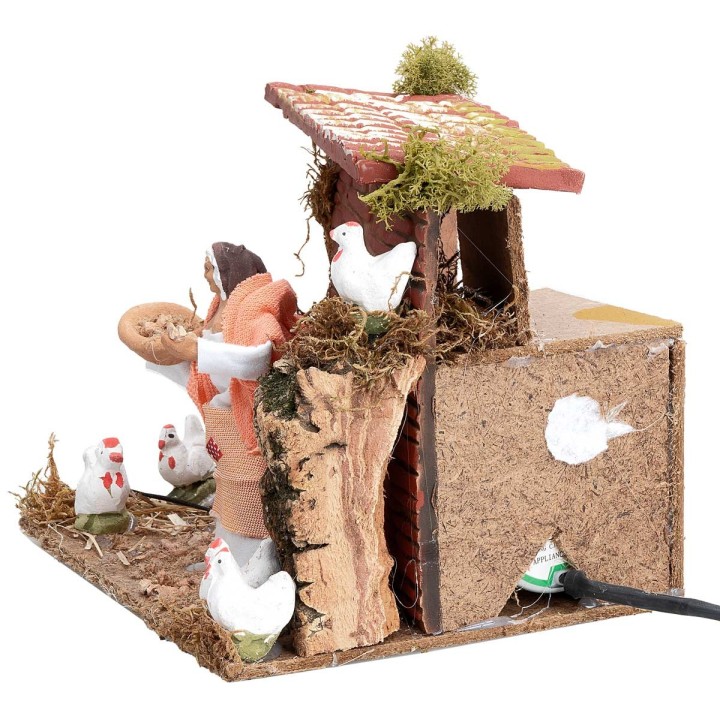 Farmer with hens 10 cm in motion 17x14x14 cm h