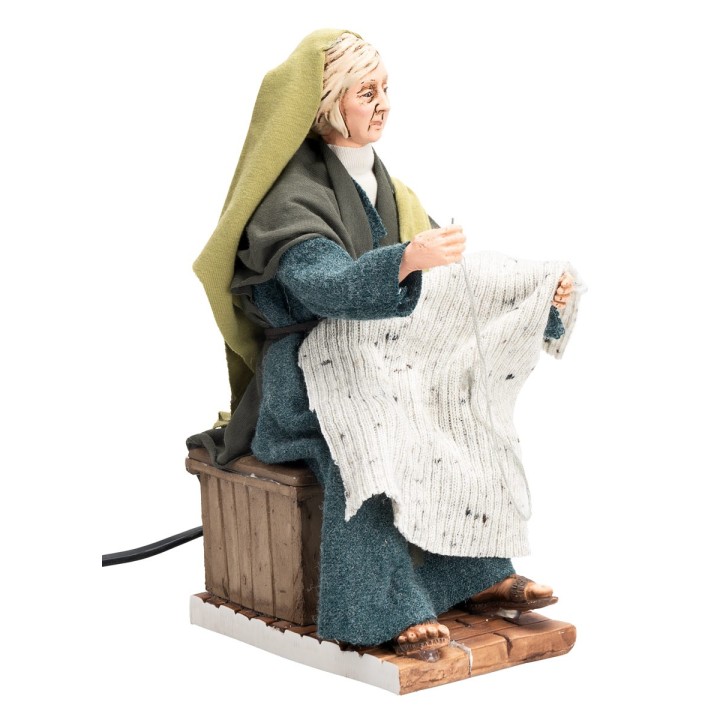 Donna in stile arabo che cuce con doppio movimento serie 30 cm