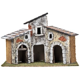 Tre case con archi in pietra e facciate invecchiate cm