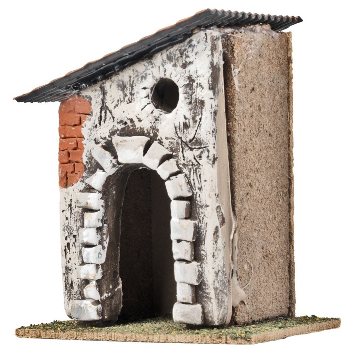 Casa con arco de piedra y techo inclinado cm 10,6x7,2x12,5 h