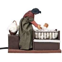 Mujer con niño en la cuna con doble movimiento serie 14 cm