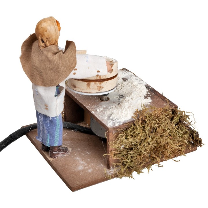 Woman with sieve and flour in motion 12 cm