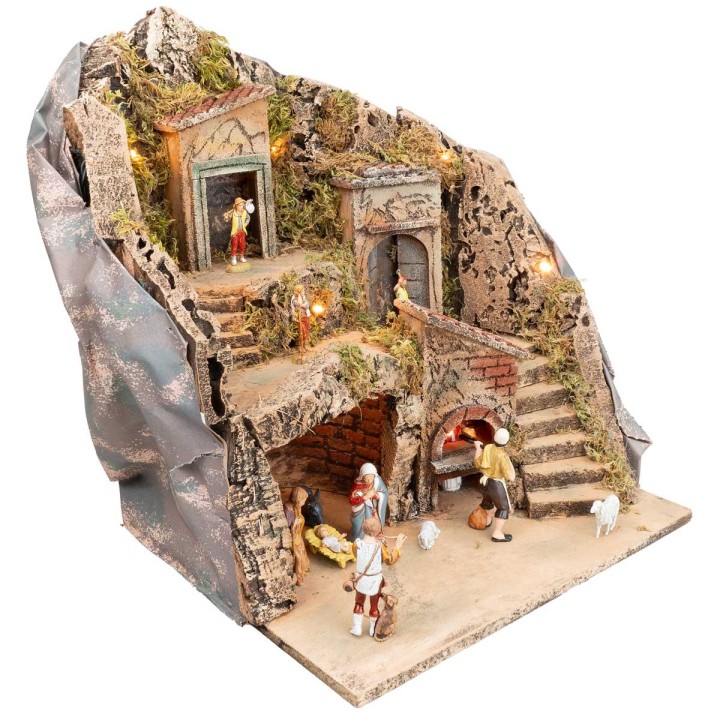 Illuminated nativity scene with working oven complete with statues