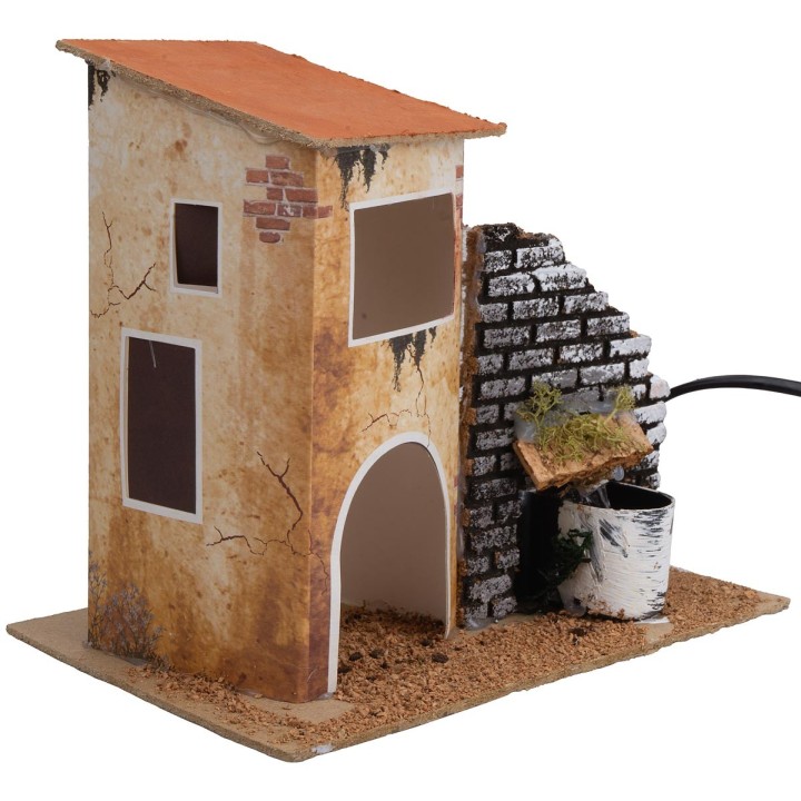 Casa con fuente funcionando cm 19x13,5x18 h.