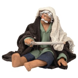 Hombre sentado avivando el fuego serie 12 cm