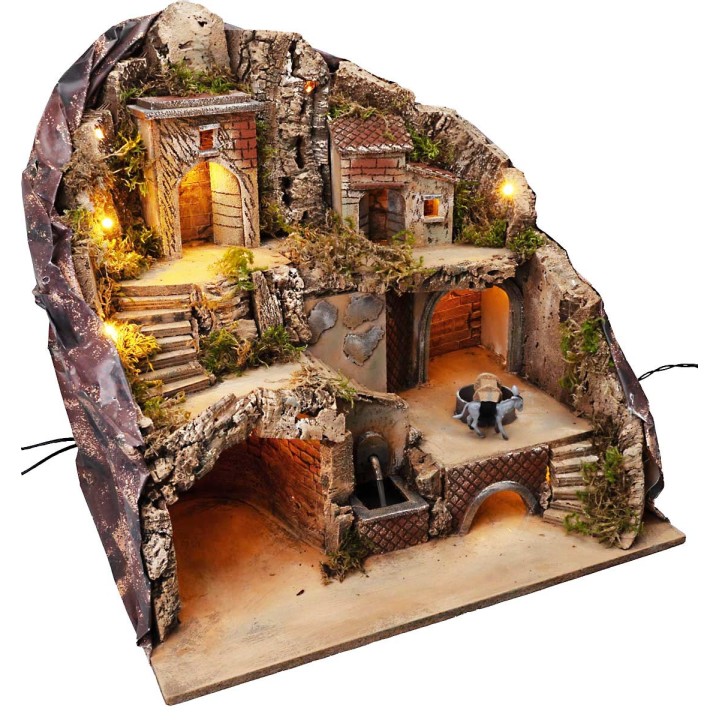 Illuminated nativity scene with fountain and