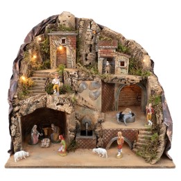 Illuminated nativity scene with fountain and